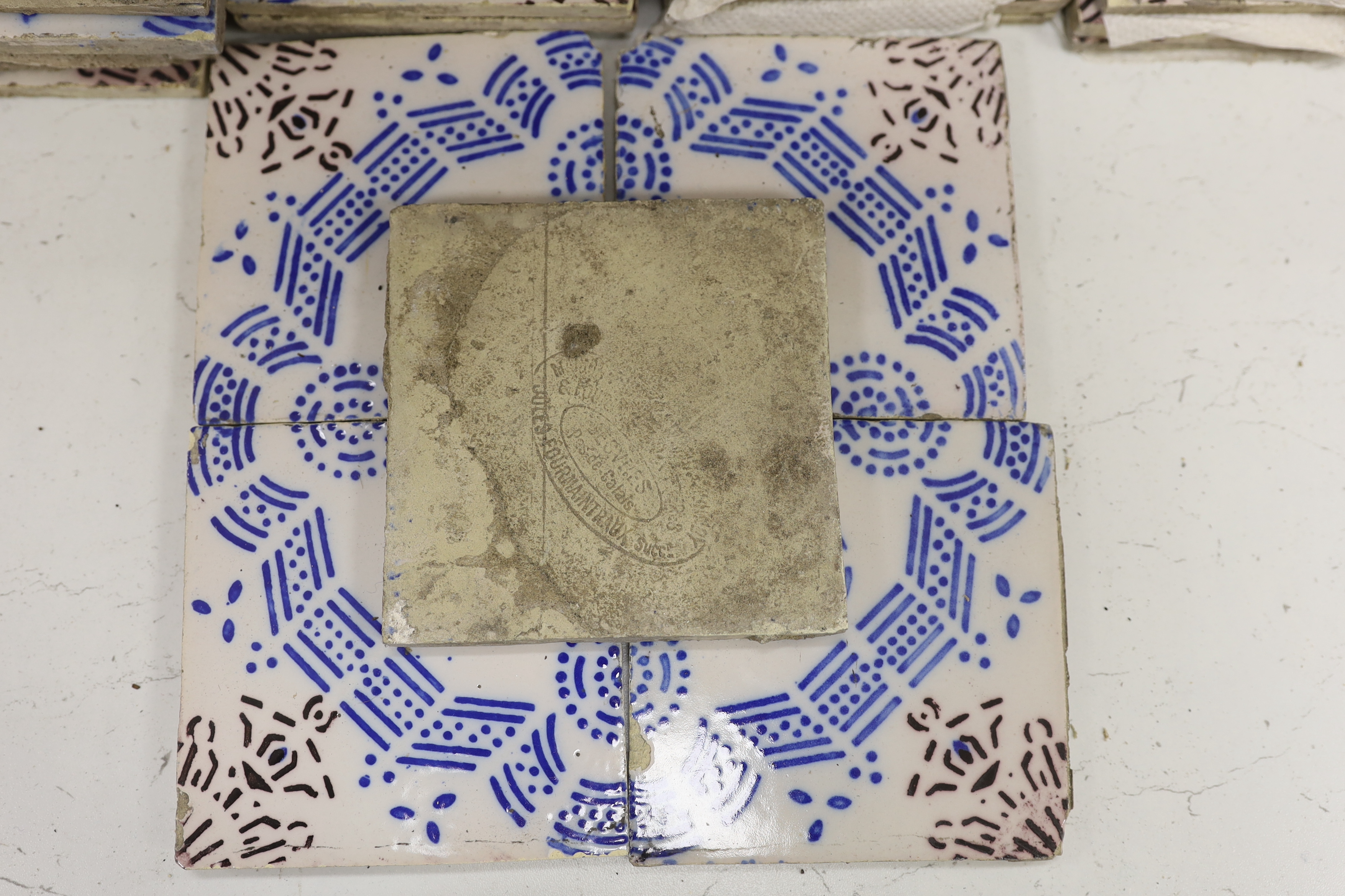 A large collection of French vintage tiles, stamped to reverse